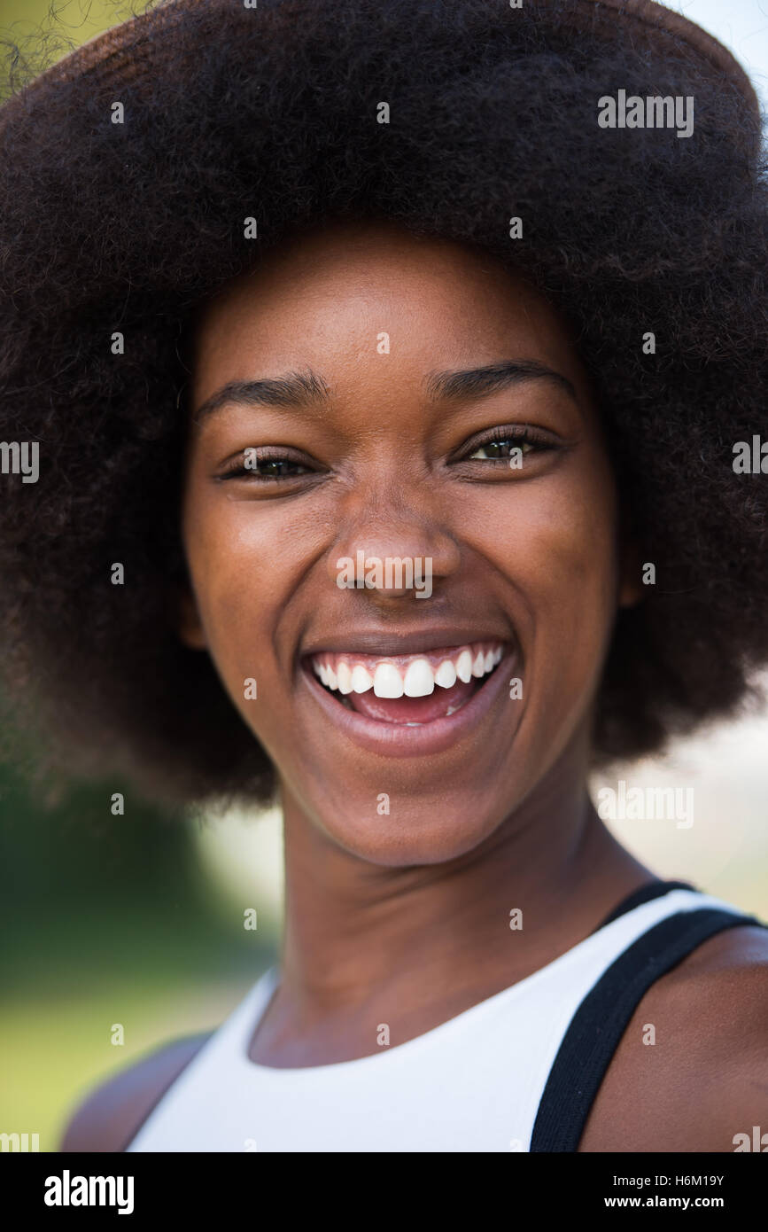 Close up portrait of a beautiful young african american woman smiling ...