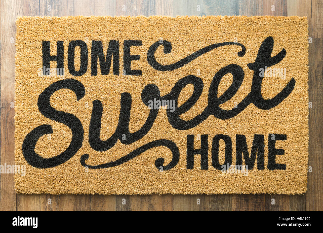 Home Sweet Home Welcome Mat On Wood Floor Stock Photo 124600681