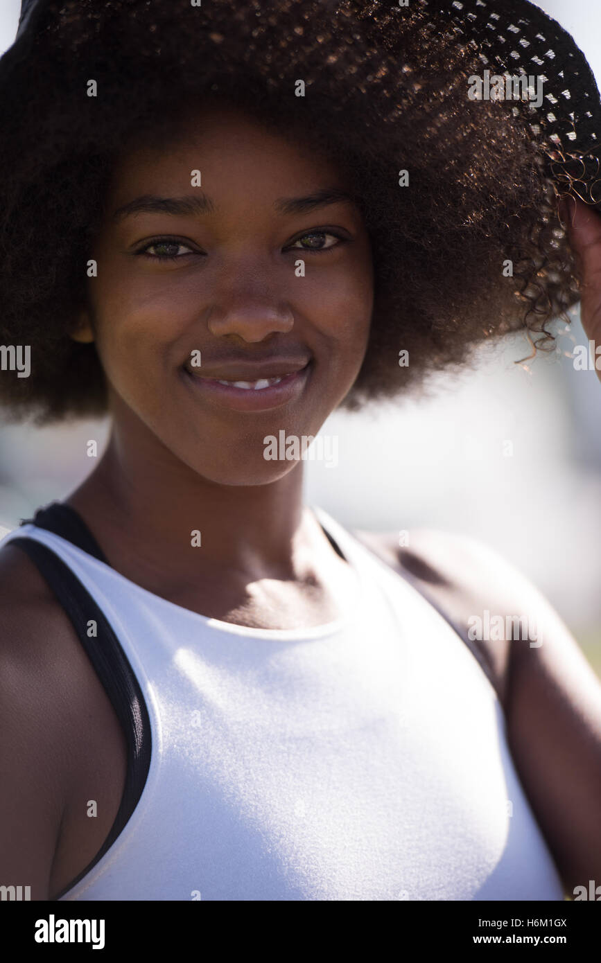Close up portrait of a beautiful young african american woman smiling ...