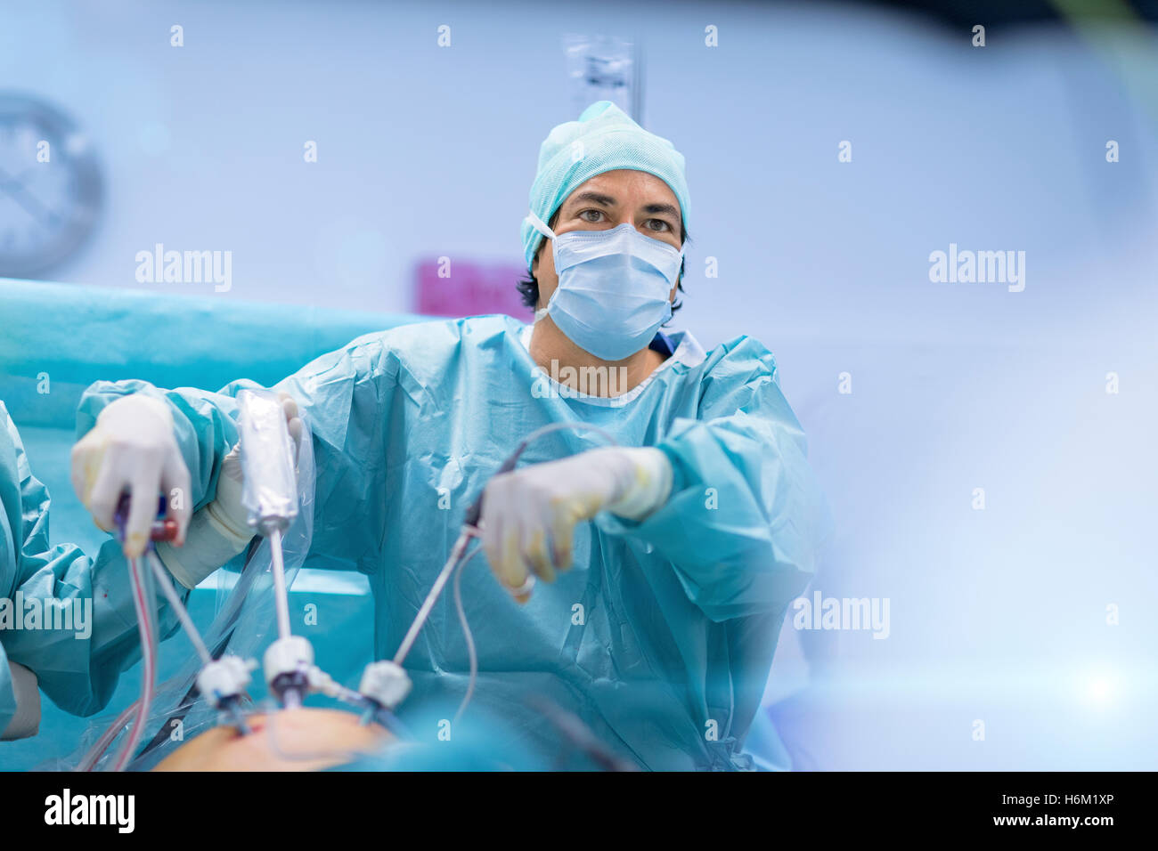 Surgeons performing surgery in operating Theater. Stock Photo