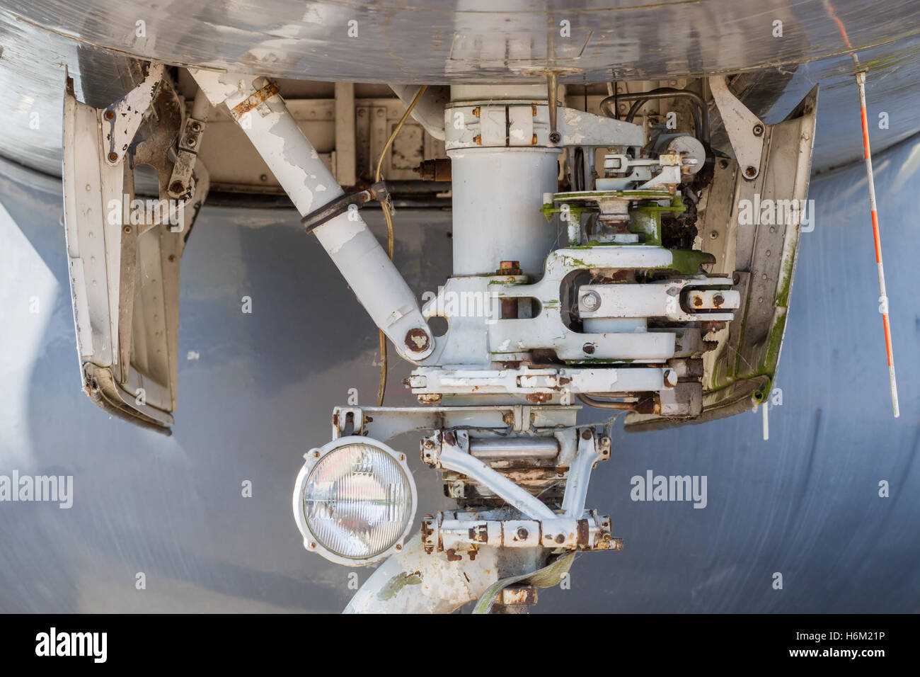 Close up aircraft nose landing gear on the tarmac Stock Photo Alamy