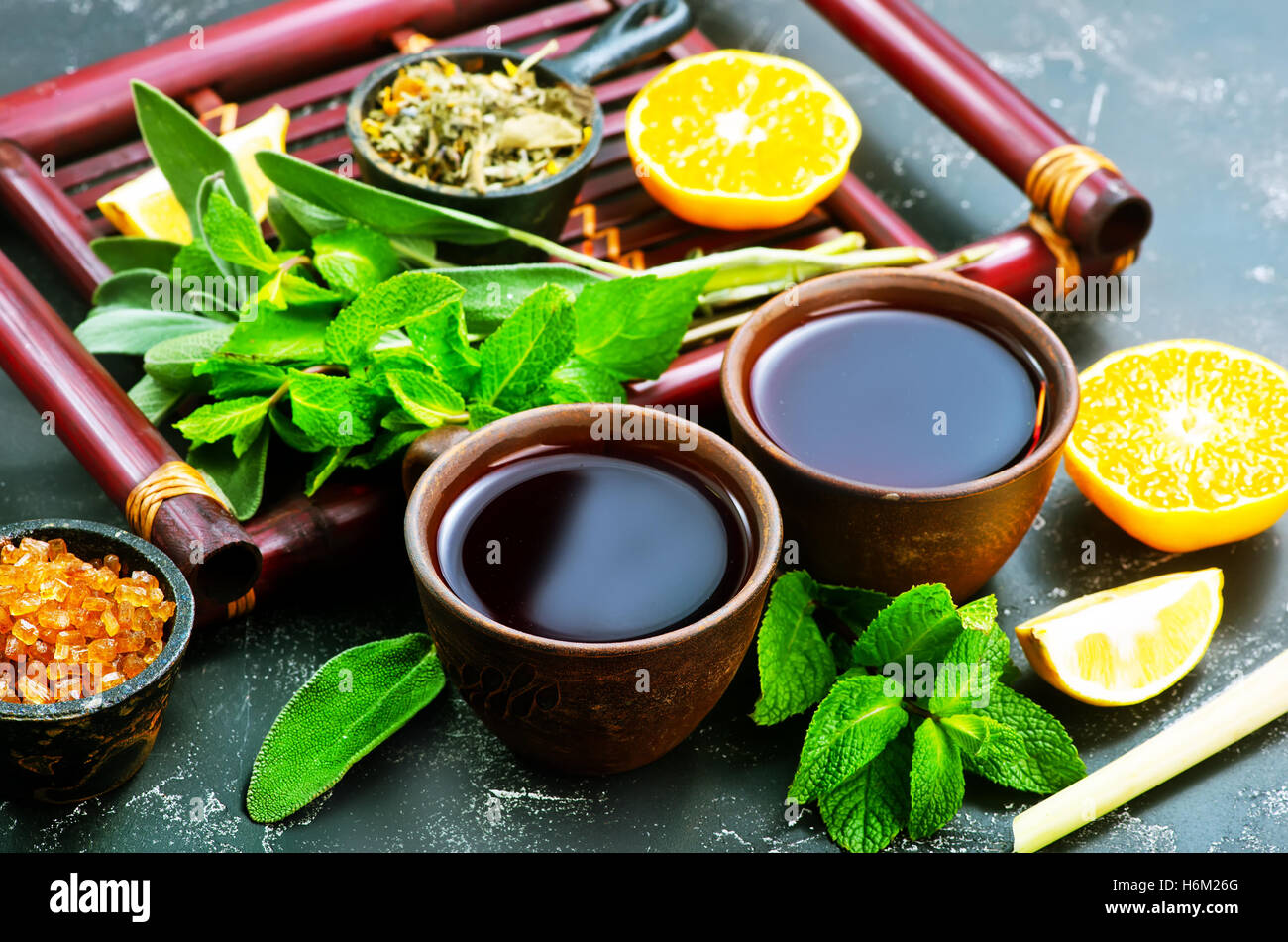 fresh tea in cups and on a table Stock Photo