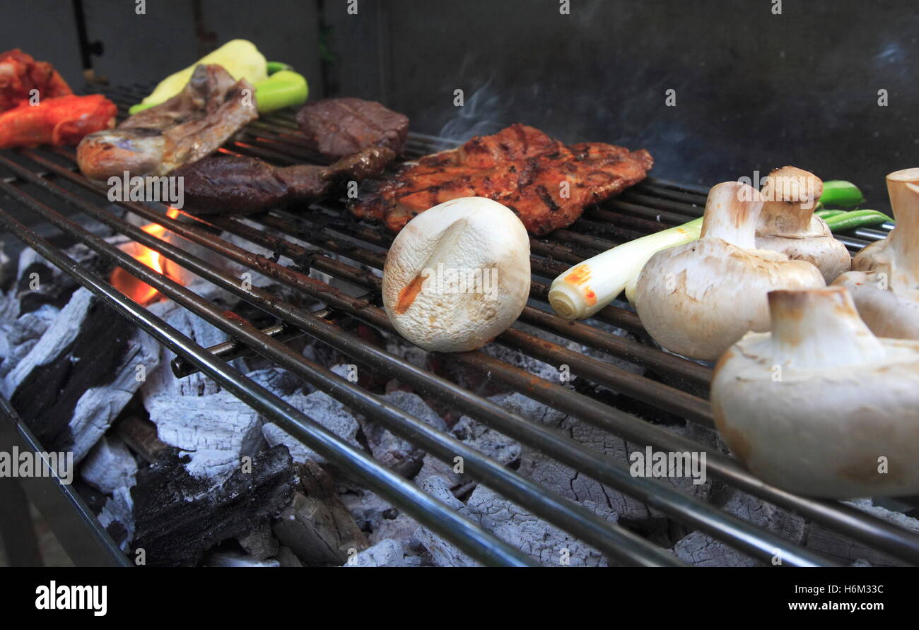 flame flickers on meat Stock Photo