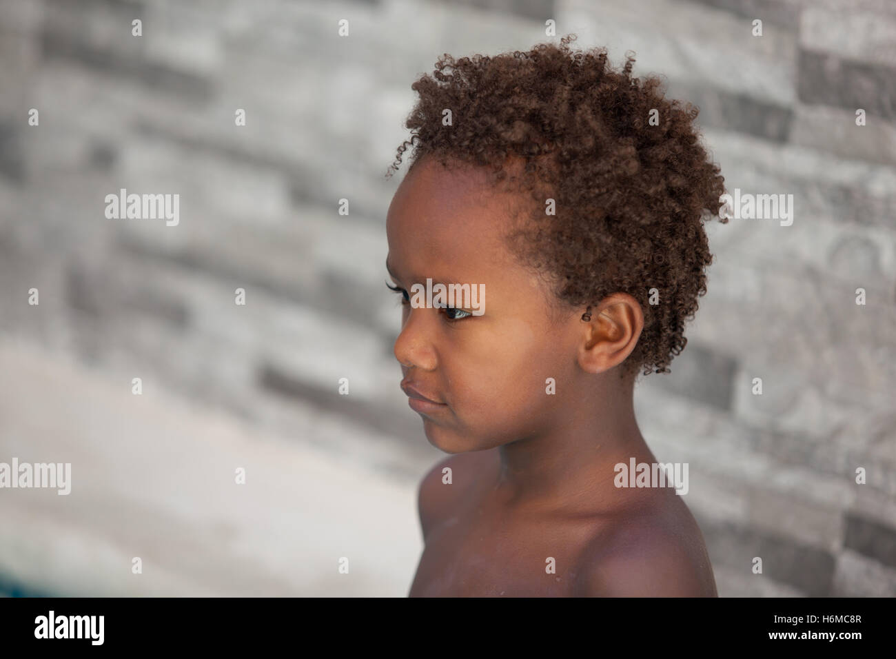 African Little Kid Three Years Without A Shirt On A Summer Day