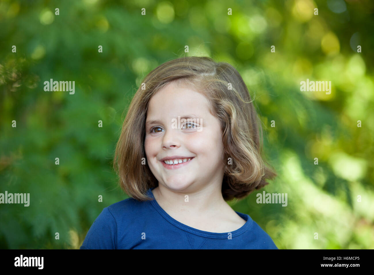 Cute little girl on the park in summer day Stock Photo - Alamy