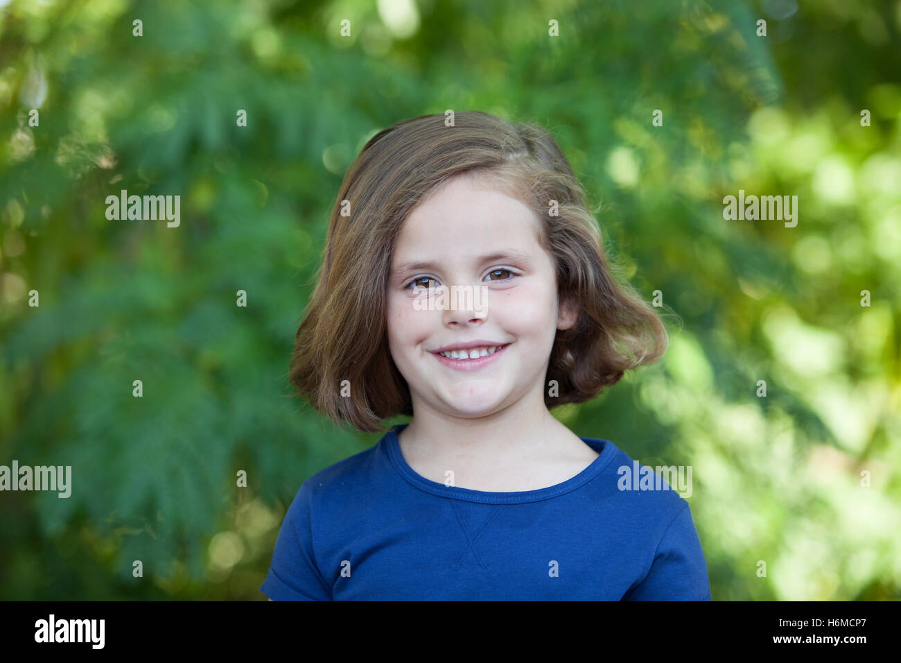 Cute little girl on the park in summer day Stock Photo - Alamy