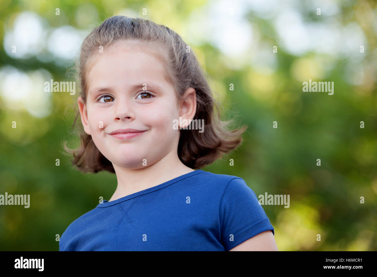 Cute little girl on the park in summer day Stock Photo - Alamy