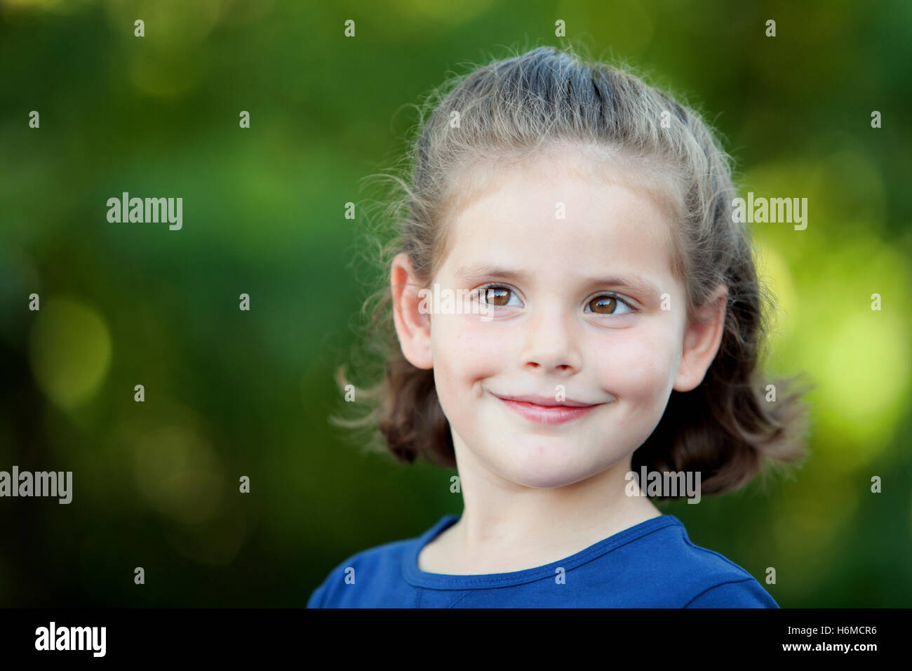 Cute little girl on the park in summer day Stock Photo - Alamy