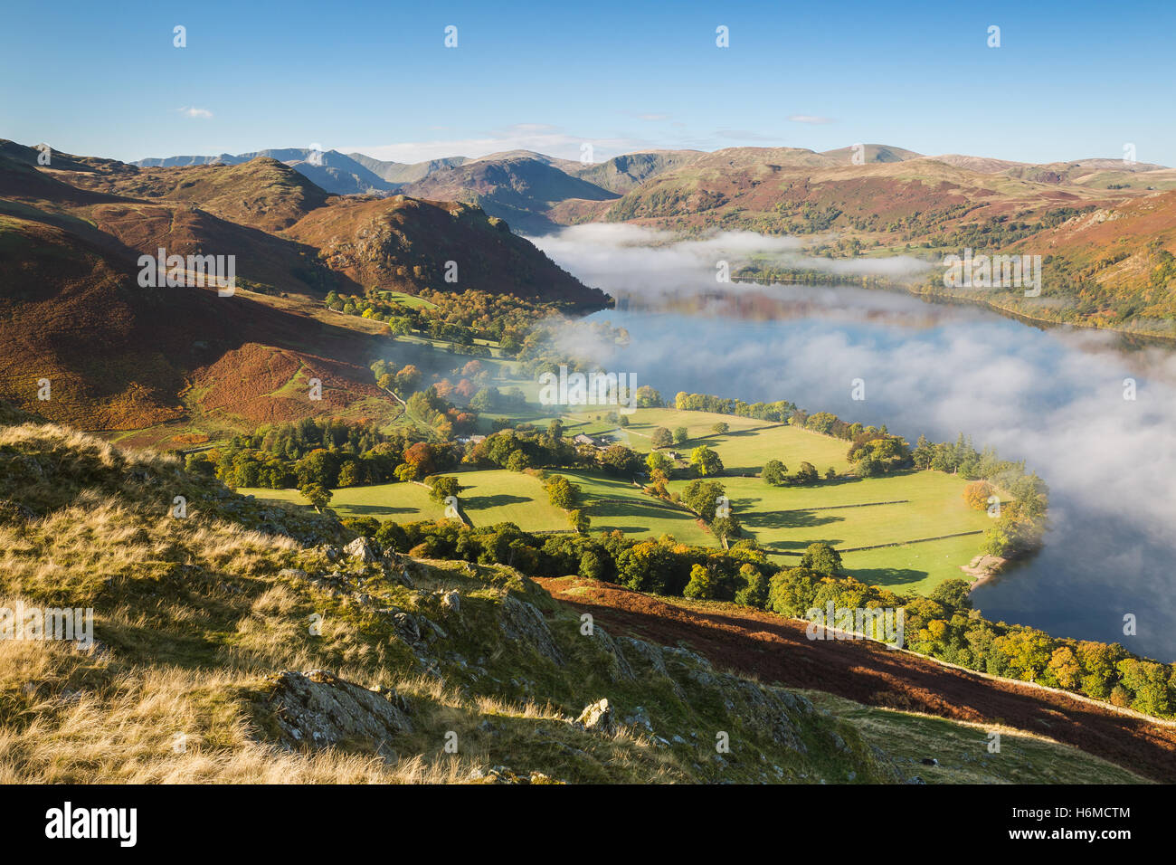 Autumnal misty dawn looking across Ullswater in the Lake District, England Stock Photo