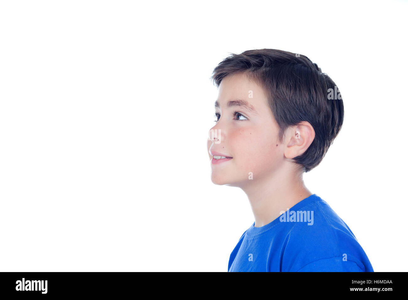 Funny child with ten years old and blue t-shirt isolated on a white background Stock Photo