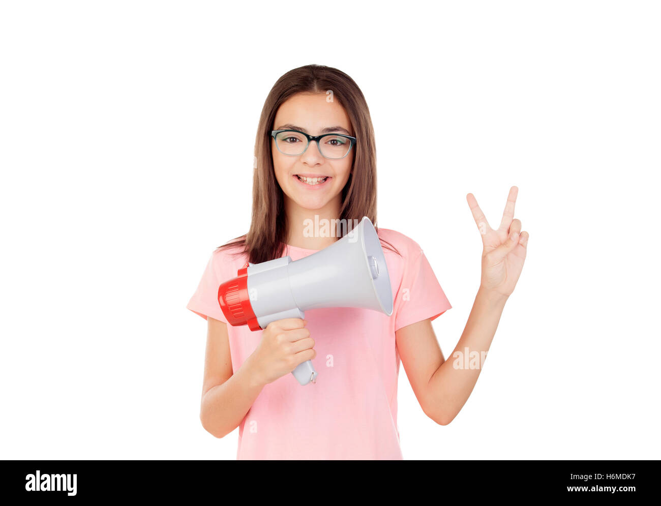 Pretty preteenager girl with a megaphone isolated on a white background Stock Photo