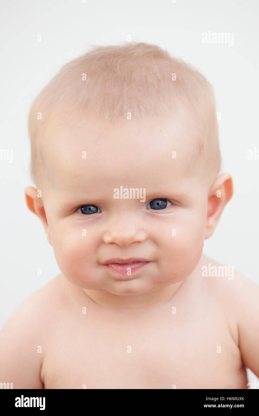 Little baby six month with blue eyes and blond hair gesturing Stock ...