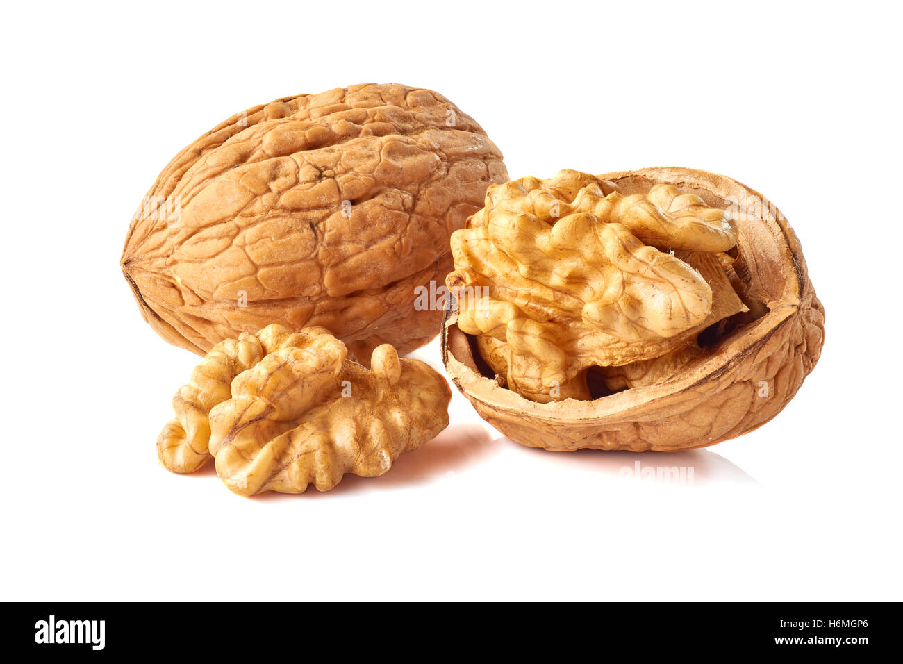 Kernel and whole walnut on white Stock Photo