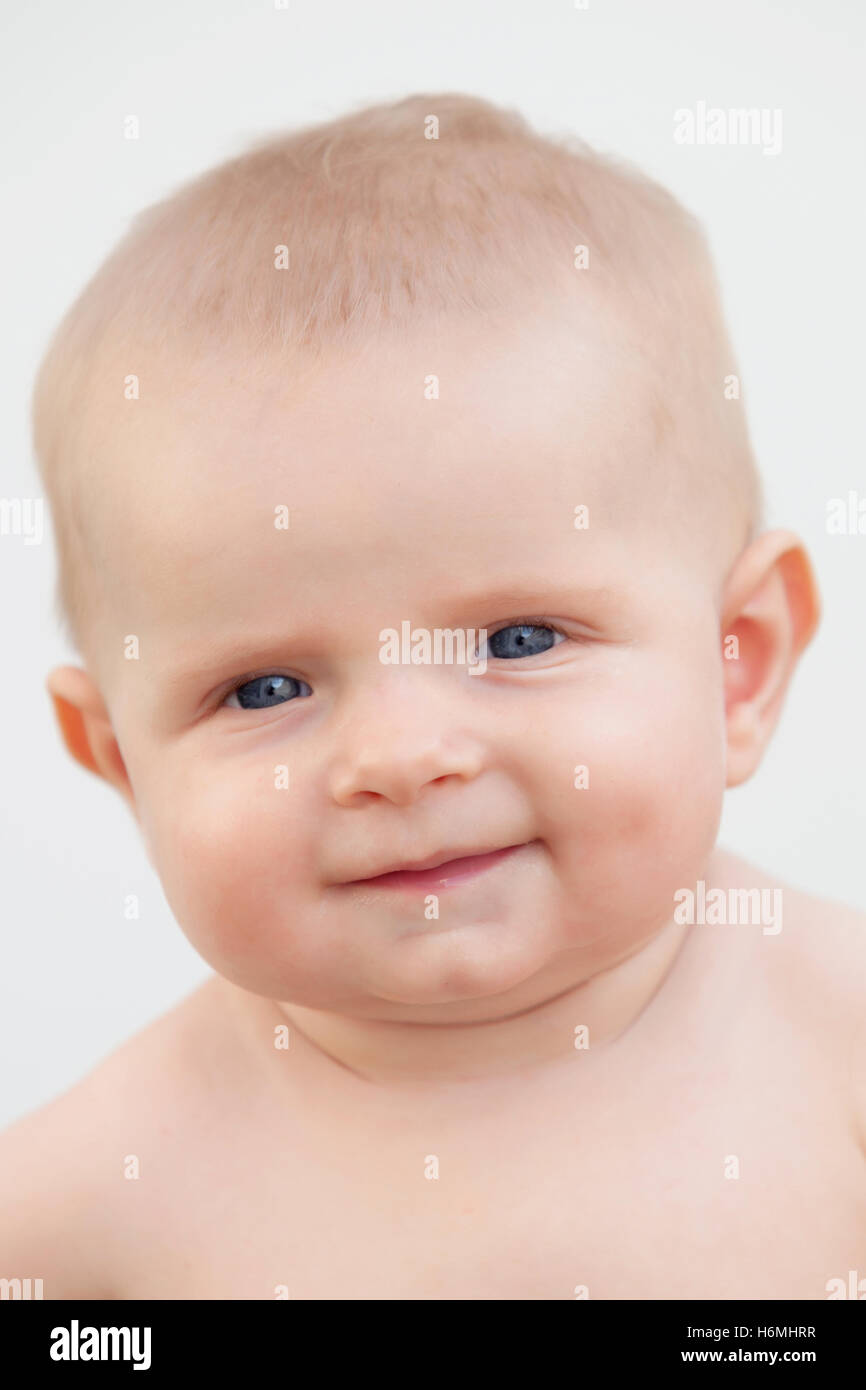 Little baby six month with blue eyes and blond hair gesturing Stock ...