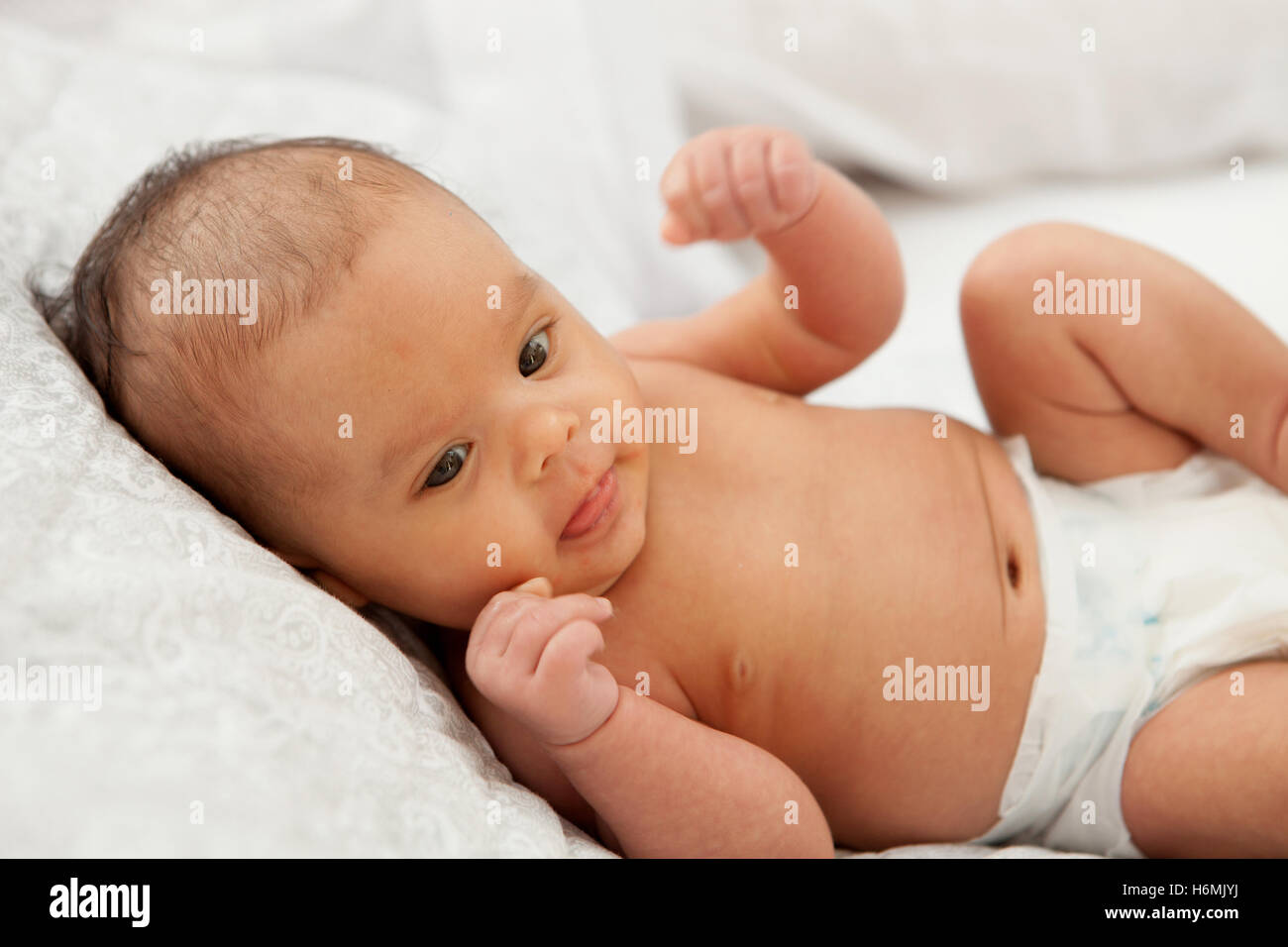 Beautiful baby in diaper with open mouth Stock Photo