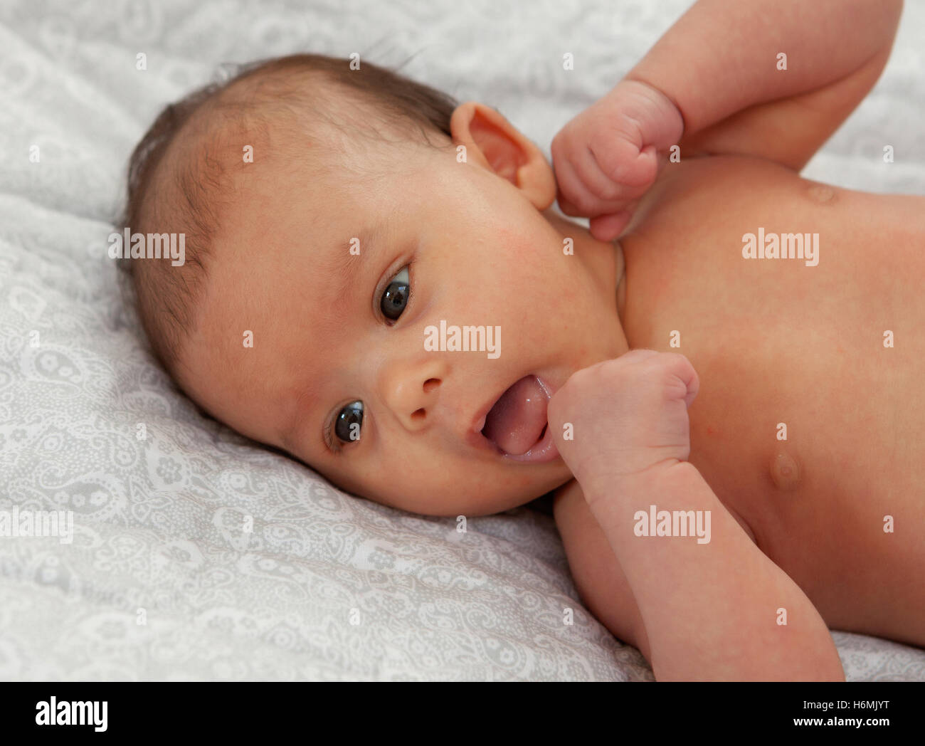 Beautiful baby in diaper with open mouth Stock Photo