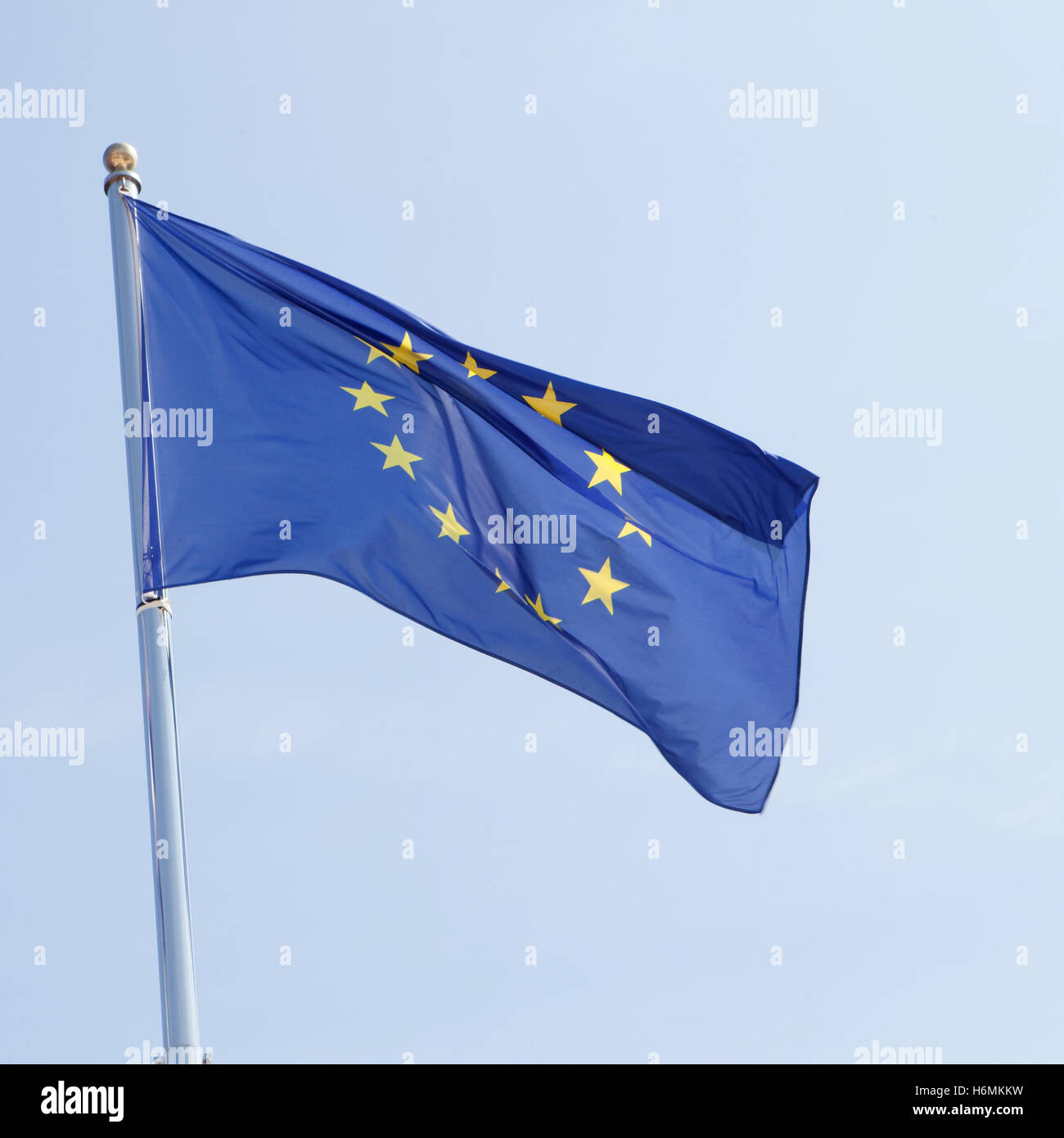 European flag waving in the mast with blue sky background Stock Photo ...