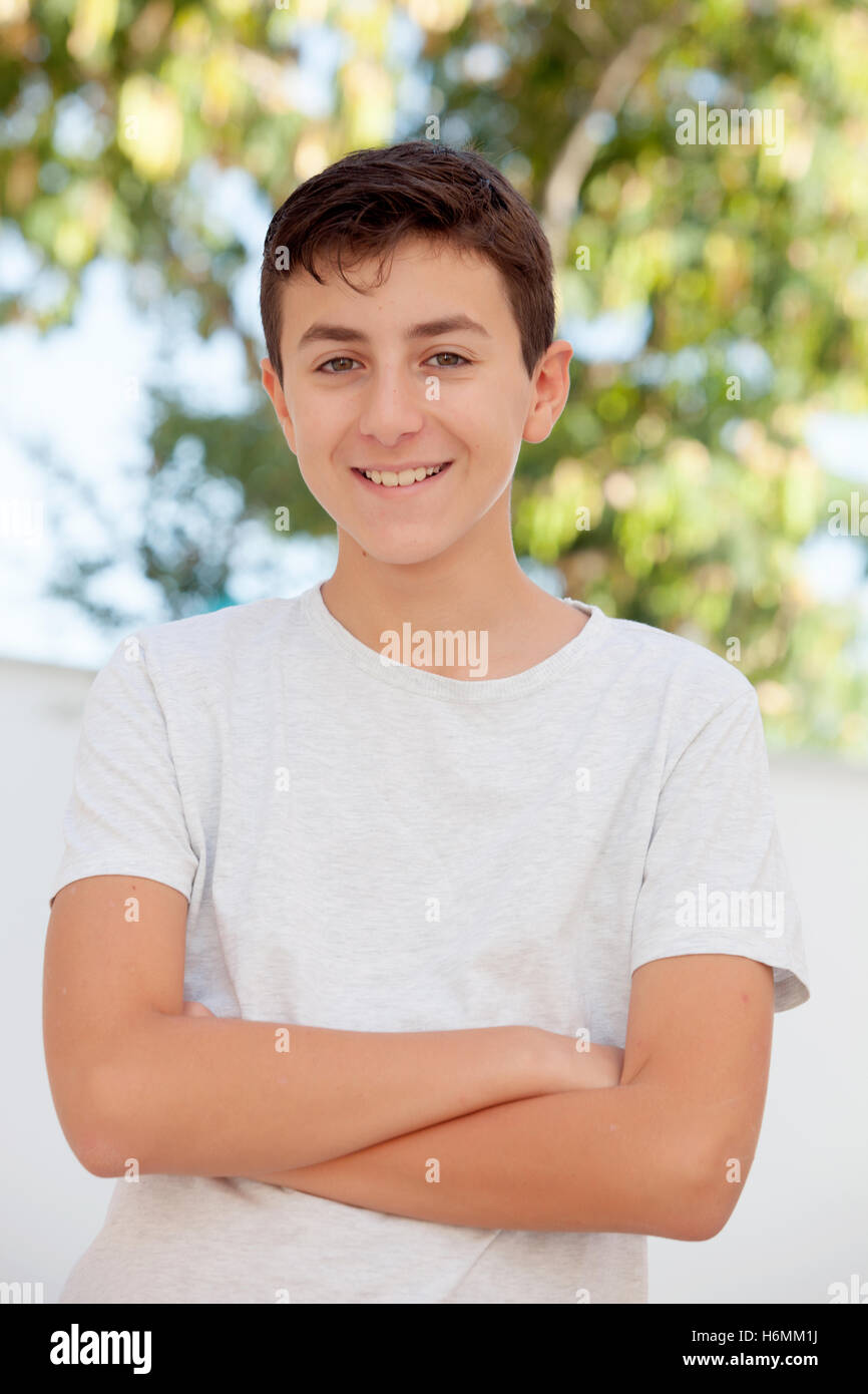Casual Thirteen year old teenage boy smiling outside Stock Photo Alamy