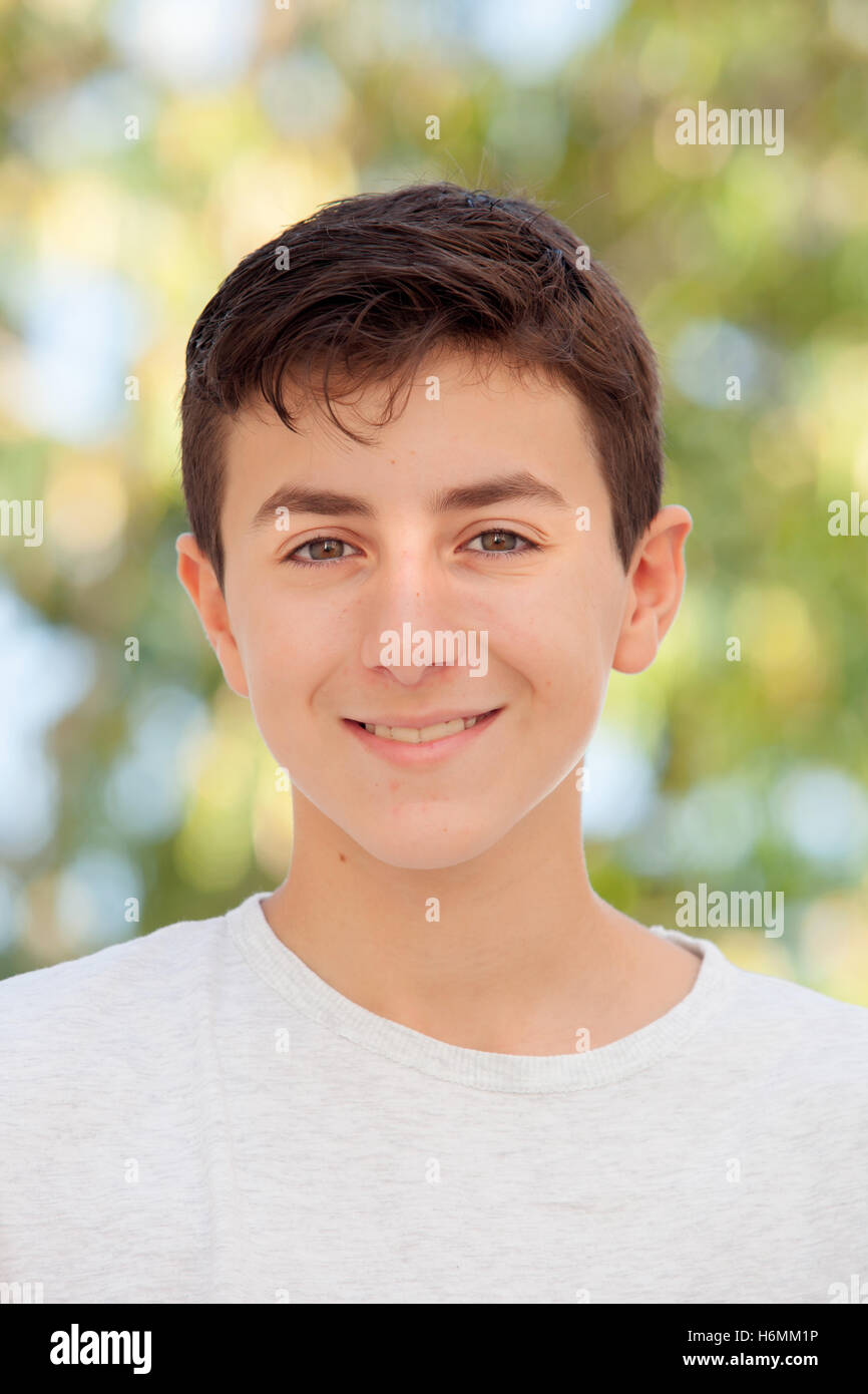 Casual Thirteen year old teenage boy smiling outside Stock Photo Alamy