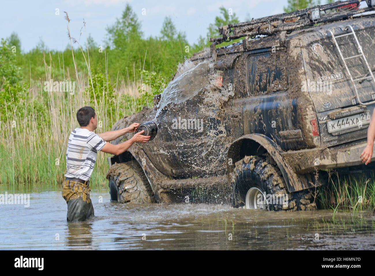 very dirty car wash in the lake Stock Photo Alamy