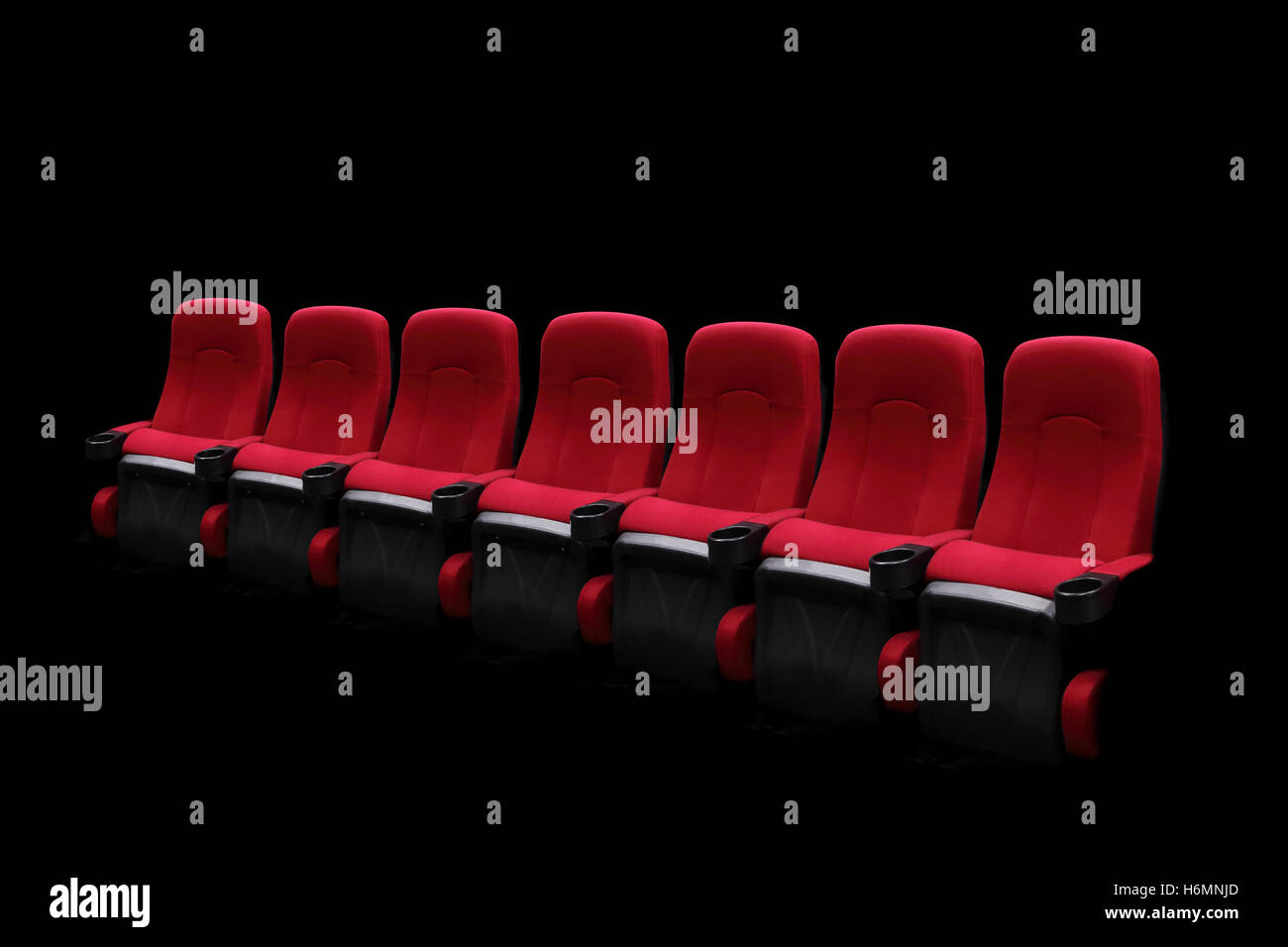 Empty theater auditorium or cinema with red seats one row Stock