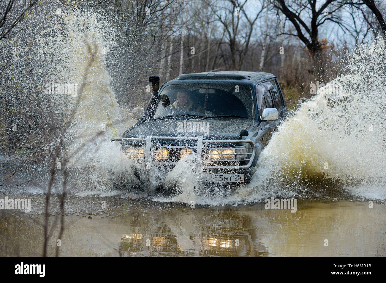 the car is driven on the offroad Stock Photo