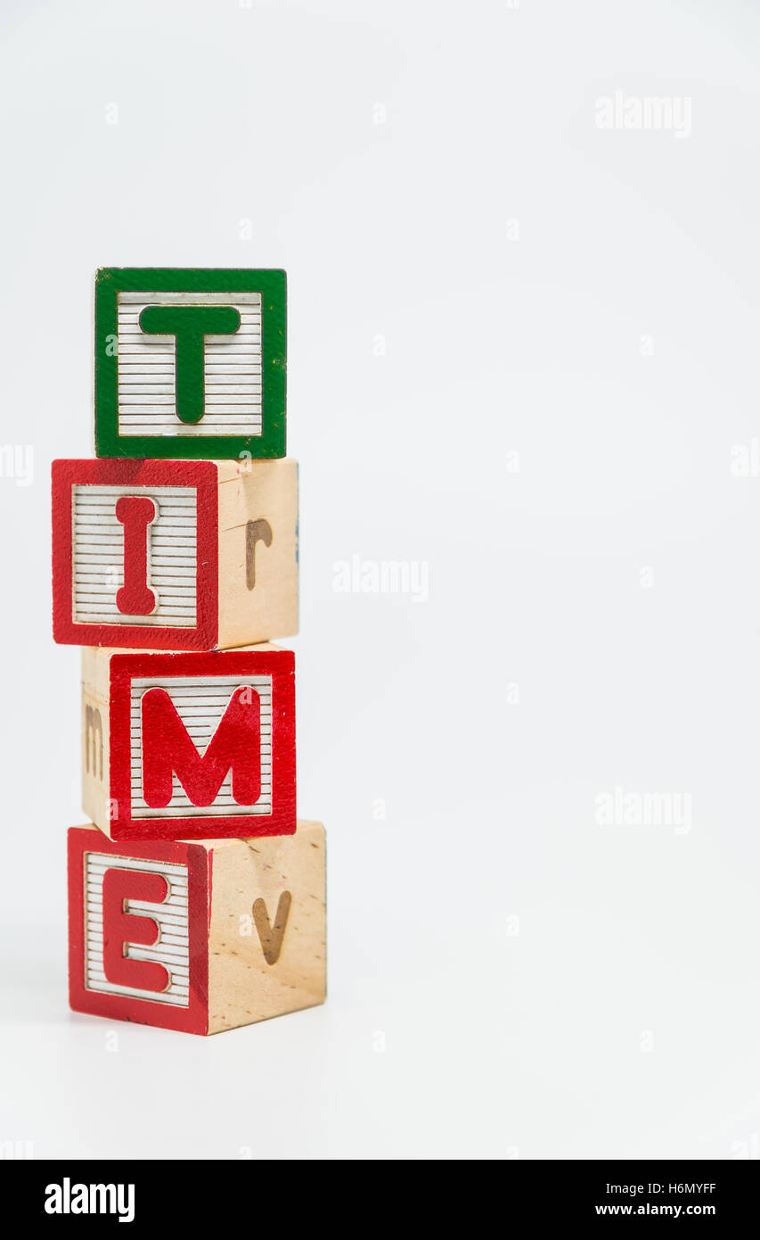 TIME word wooden block arrange in vertical style on white background ...