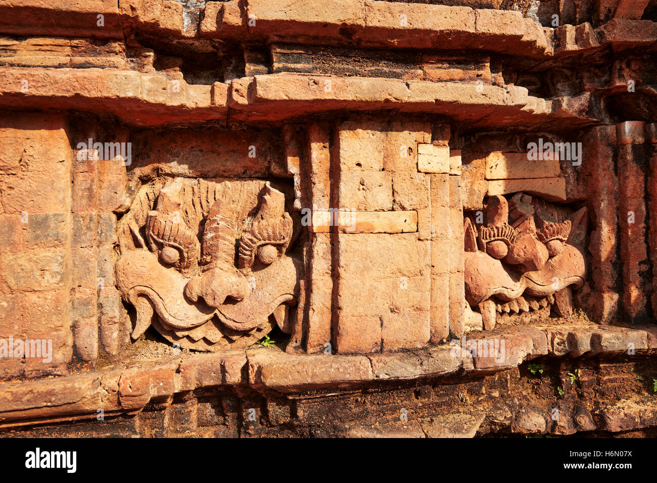 Kirtimukha (Kala) faces on a temple in Group G. My Son Sanctuary, Quang Nam Province, Vietnam. Stock Photo