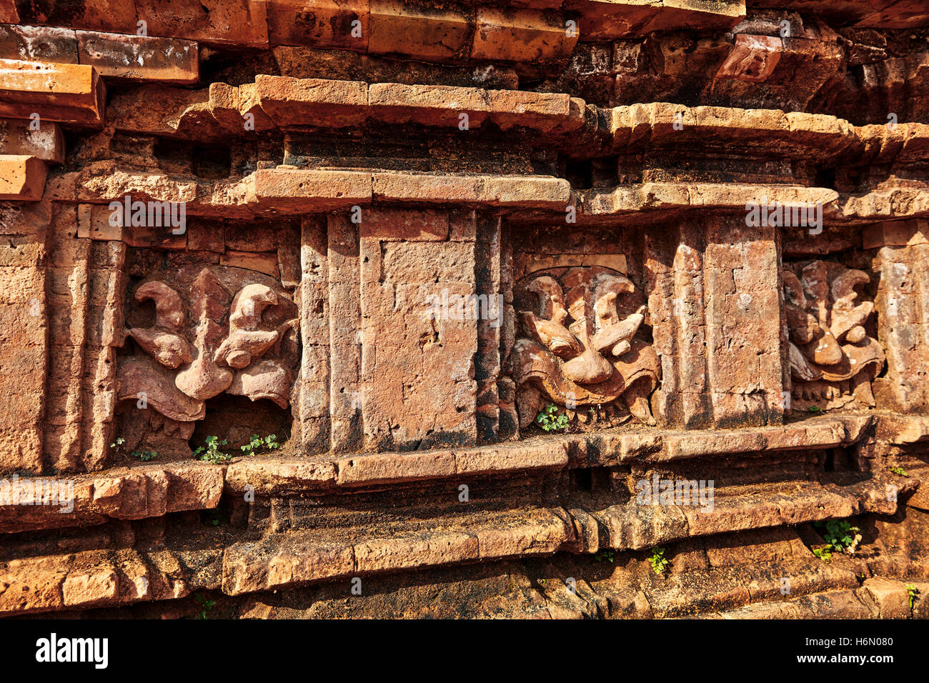 Kirtimukha (Kala) faces on a temple in Group G. My Son Sanctuary, Quang Nam Province, Vietnam. Stock Photo