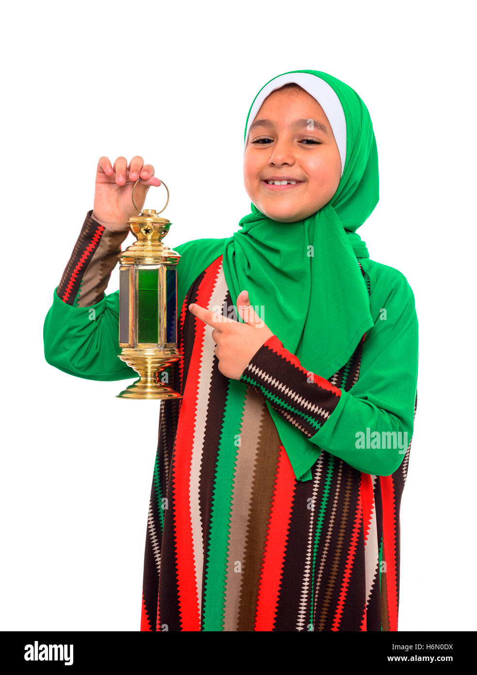 Happy Muslim Girl Pointing at Ramadan Lantern Isolated on White Background Stock Photo