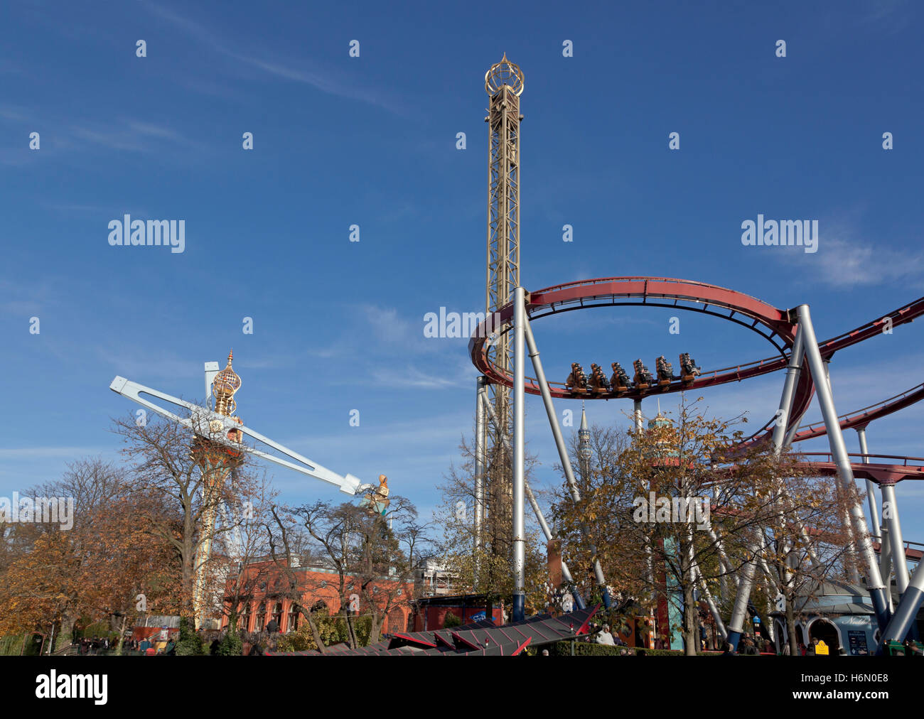 The Vertigo, the Golden Tower, and the Demon rides in the Tivoli Gardens in  Copenhagen on a sunny end October afternoon. Halloween season opening Stock  Photo - Alamy