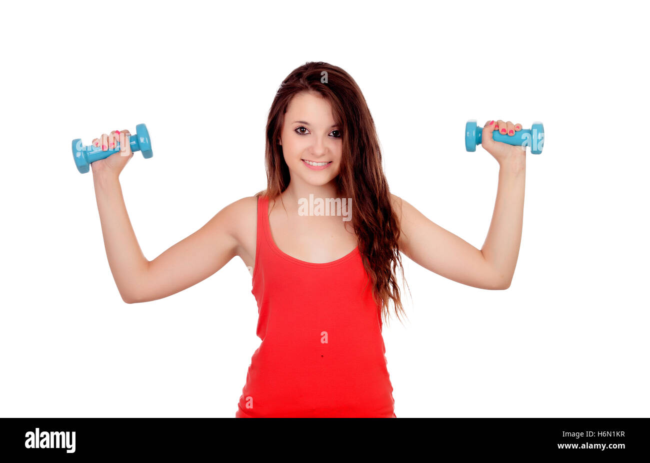 Attractive young girl with dumbbells isolated on a white background Stock Photo