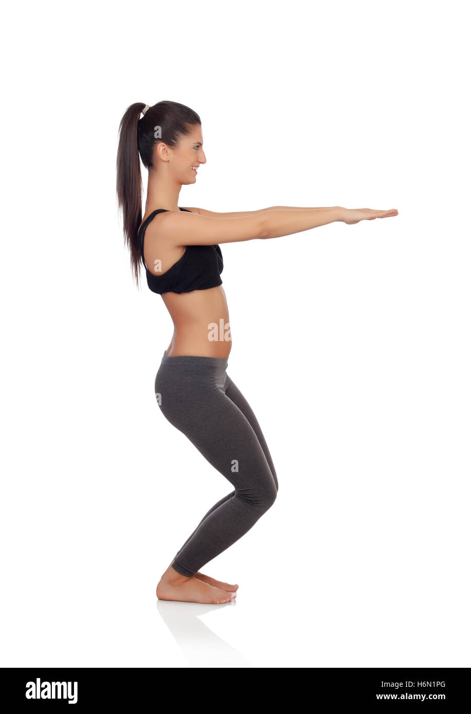 Woman doing exercises isolated on a white background Stock Photo