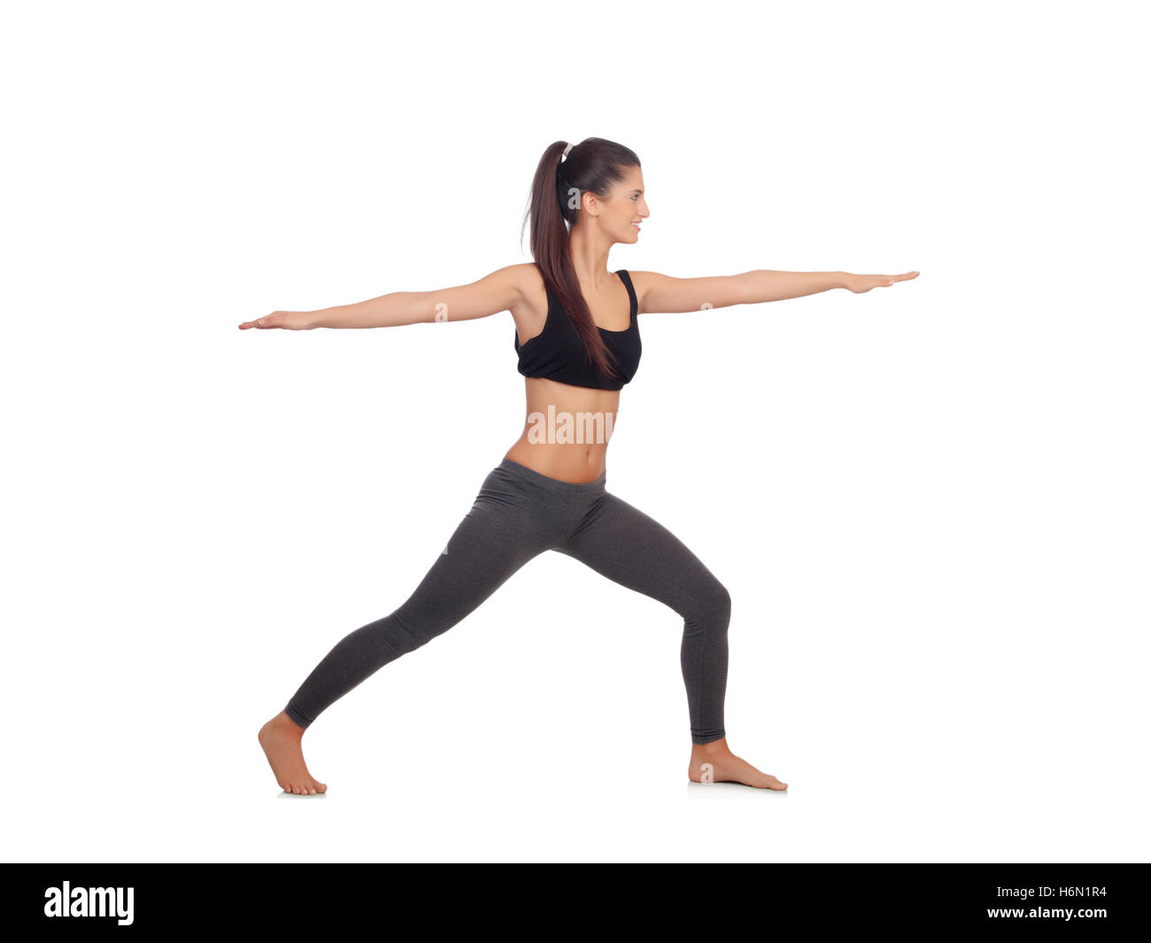 Woman doing stretching exercises isolated on a white background Stock Photo