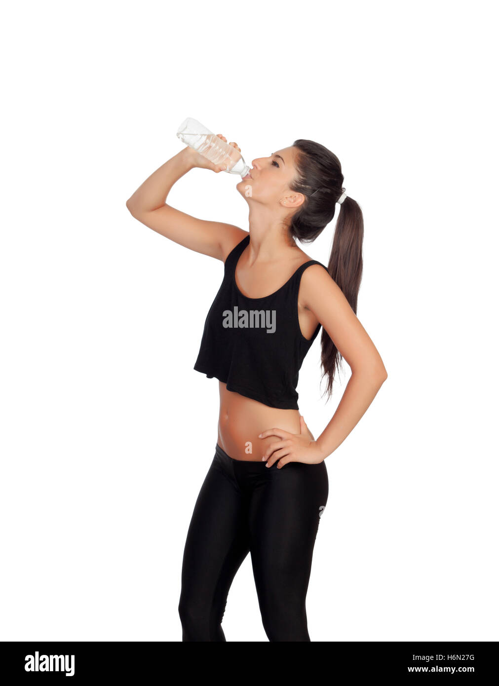 Fitness girl drinking water isolated on a white background Stock Photo