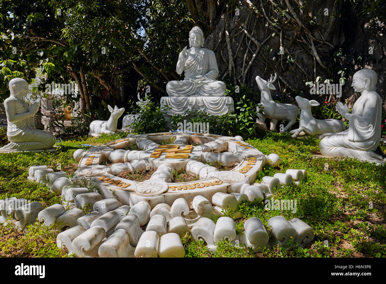 Marble sculptural group showing Buddha teaching people and animals on Thuy Son Mountain. The Marble Mountains, Da Nang, Vietnam. Stock Photo