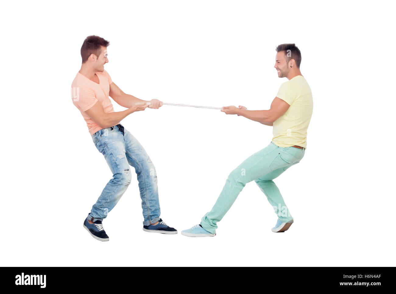 Two boys pulling a rope isolated on a white background Stock Photo Alamy