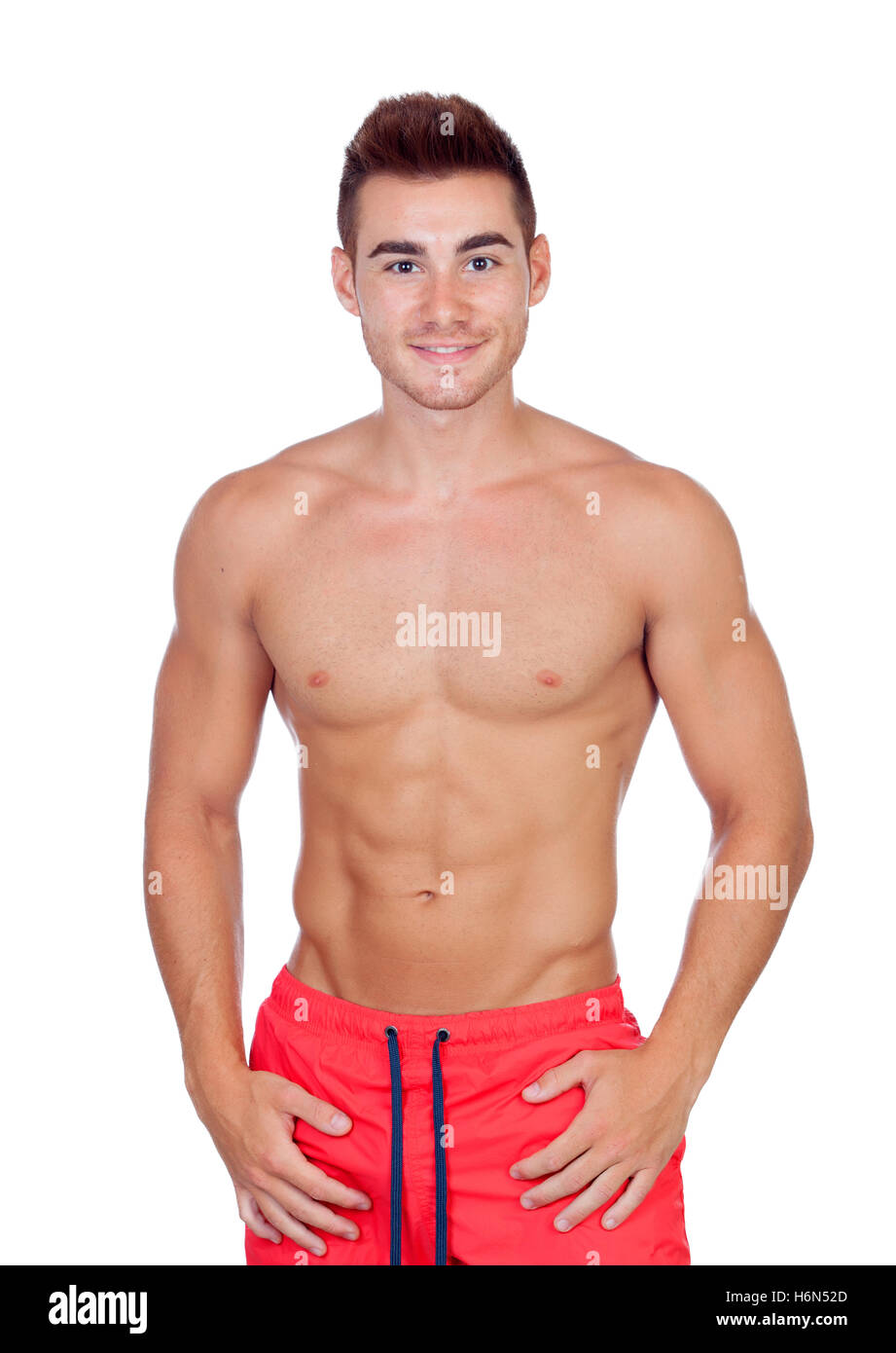 Handsome lifeguard with red swimsuit isolated on white background Stock Photo