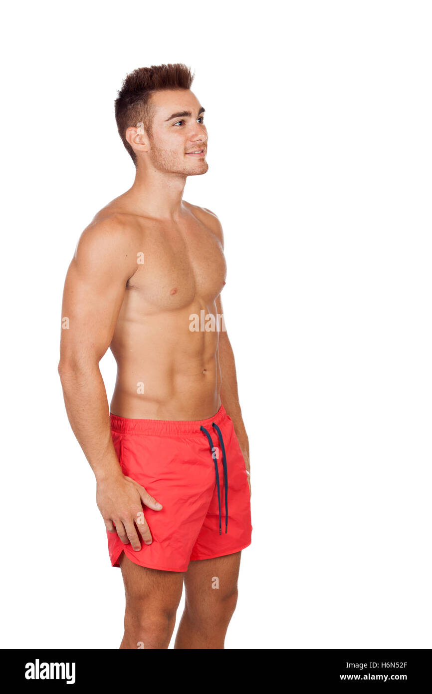 Handsome lifeguard with red swimsuit isolated on white background Stock Photo