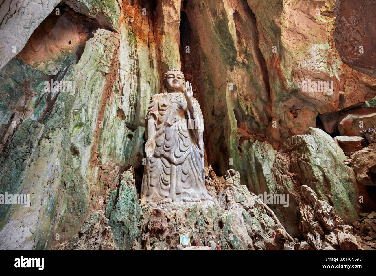 The Upright Buddha statue in Tang Chon Cave. Thuy Son Mountain, The Marble Mountains, Da Nang, Vietnam. Stock Photo