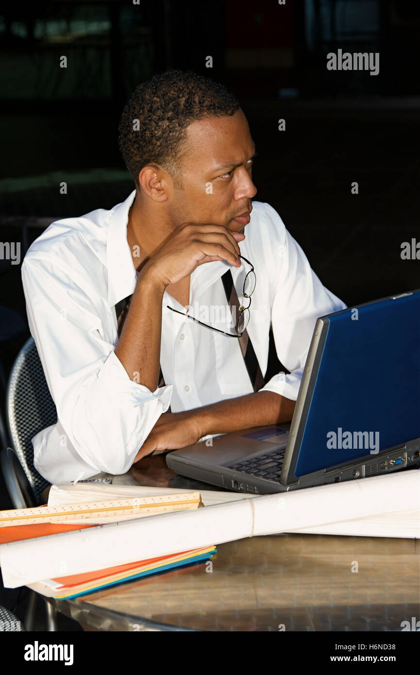 Black man laptop computer outside patio hi-res stock photography and ...