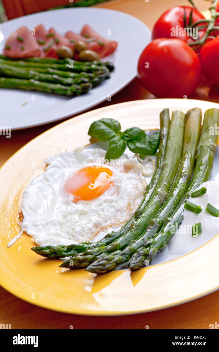 green asparagus with fried egg and salad Stock Photo Alamy