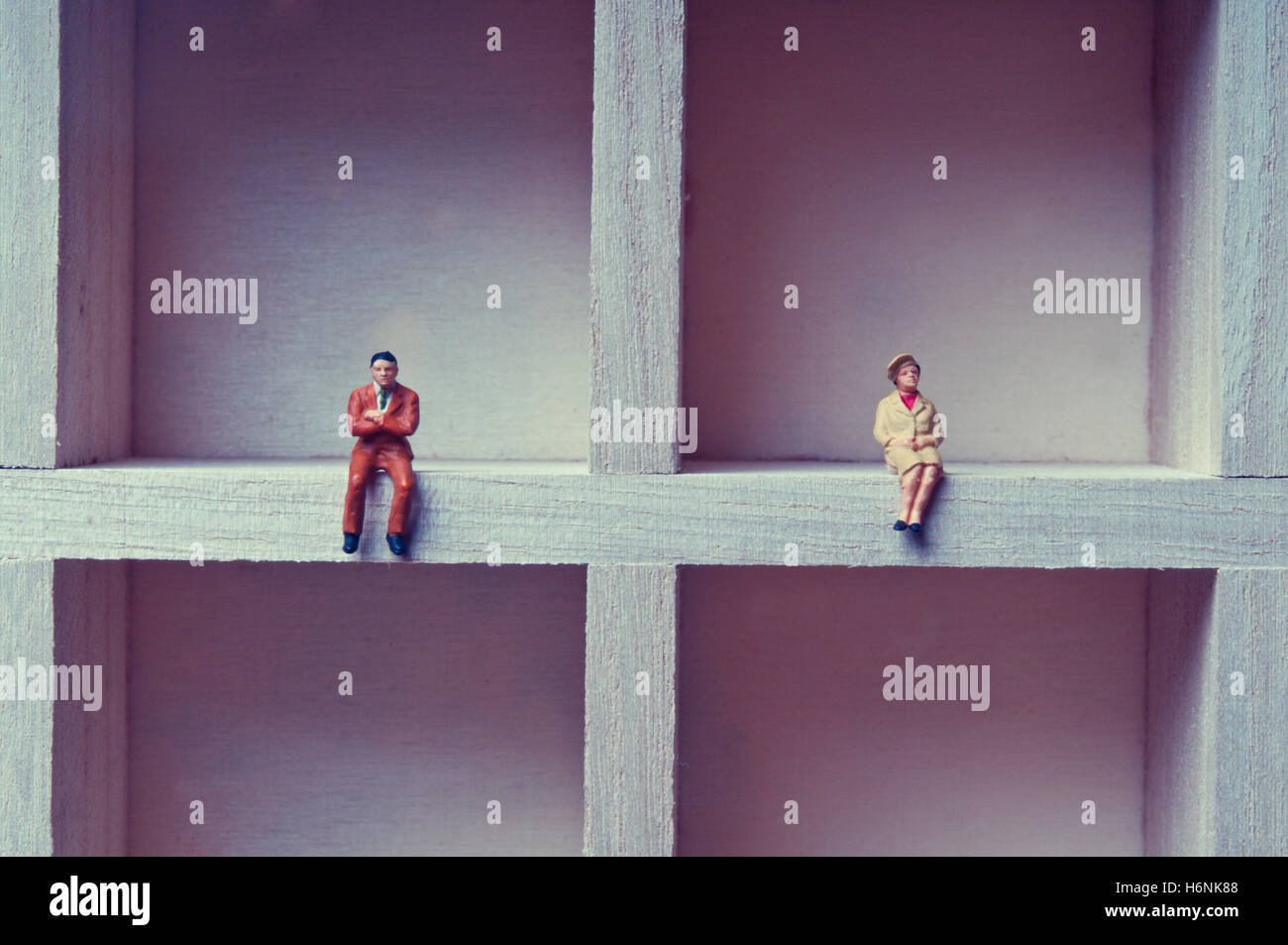 couple separated and non communicating concept, with miniature figurines Stock Photo