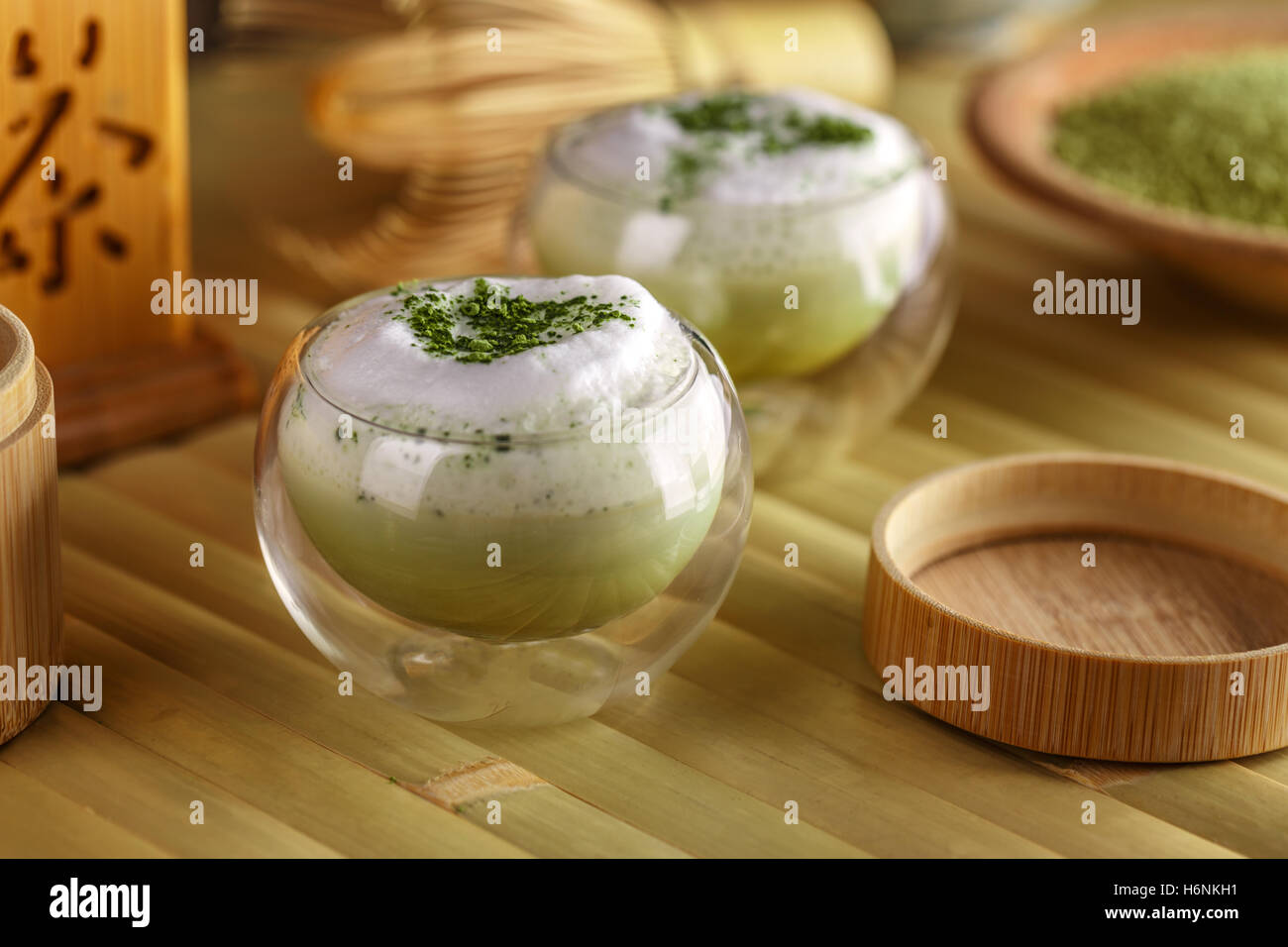 Glass cup of green tea matcha latte Stock Photo