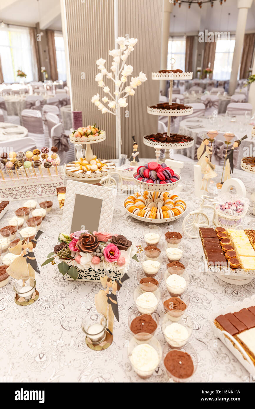 Delicious sweet buffet with mousse, macaron and other desserts. Stock Photo