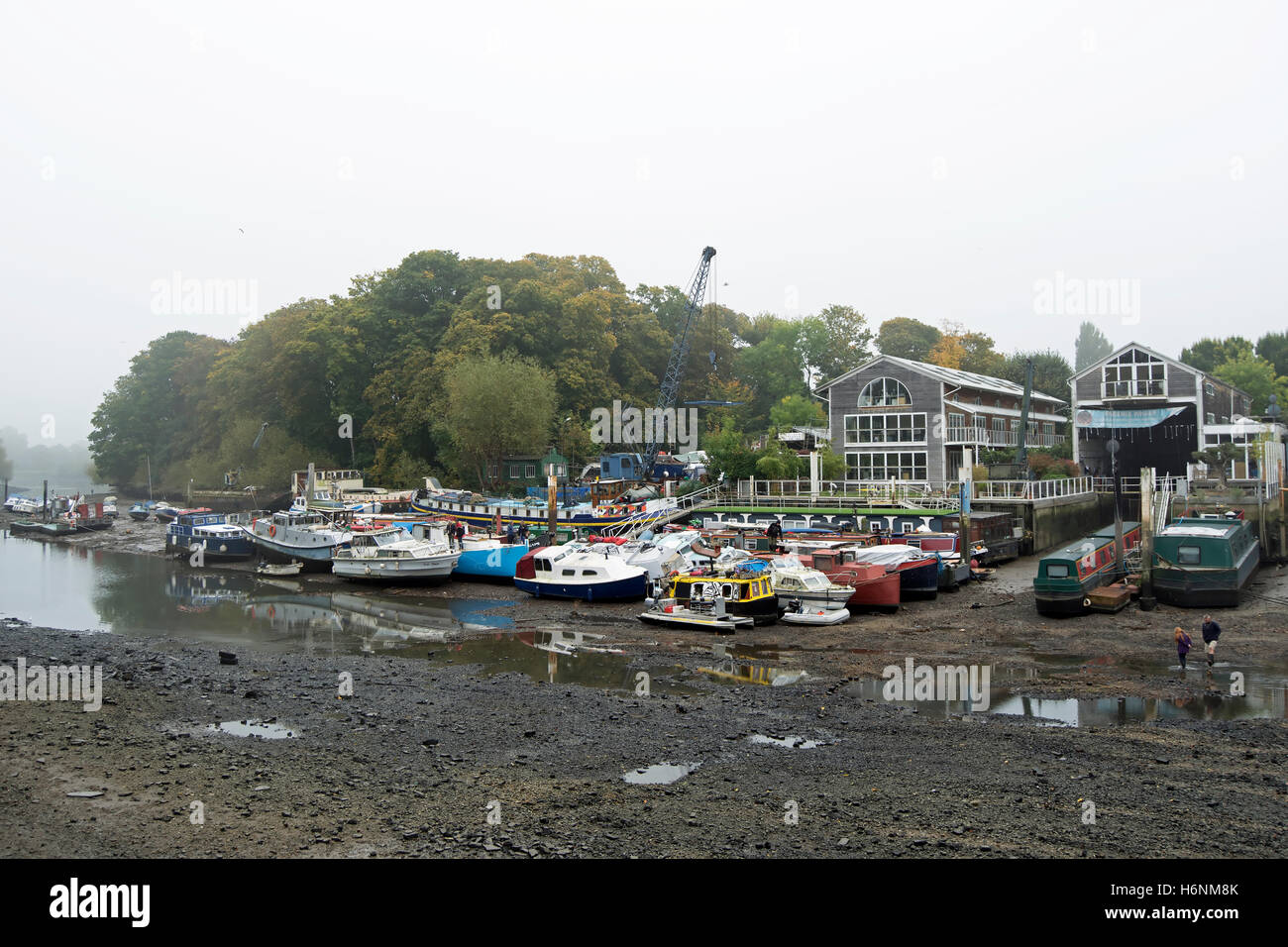 boatyards of eel pie island during the annual draw off, when the river thames is allowed to reach its natural low tide level Stock Photo