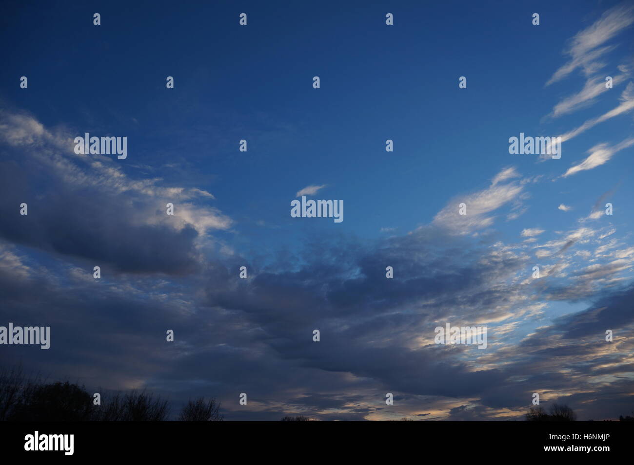 Blue sky with clouds background Stock Photo - Alamy