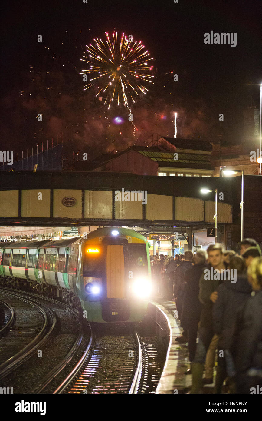 Tourists travelling by train to Lewes station on Bonfire Night or Guy