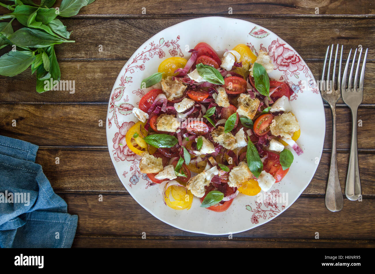Tomato, chicory and goat's cheese salad with toasted bread Stock Photo Alamy