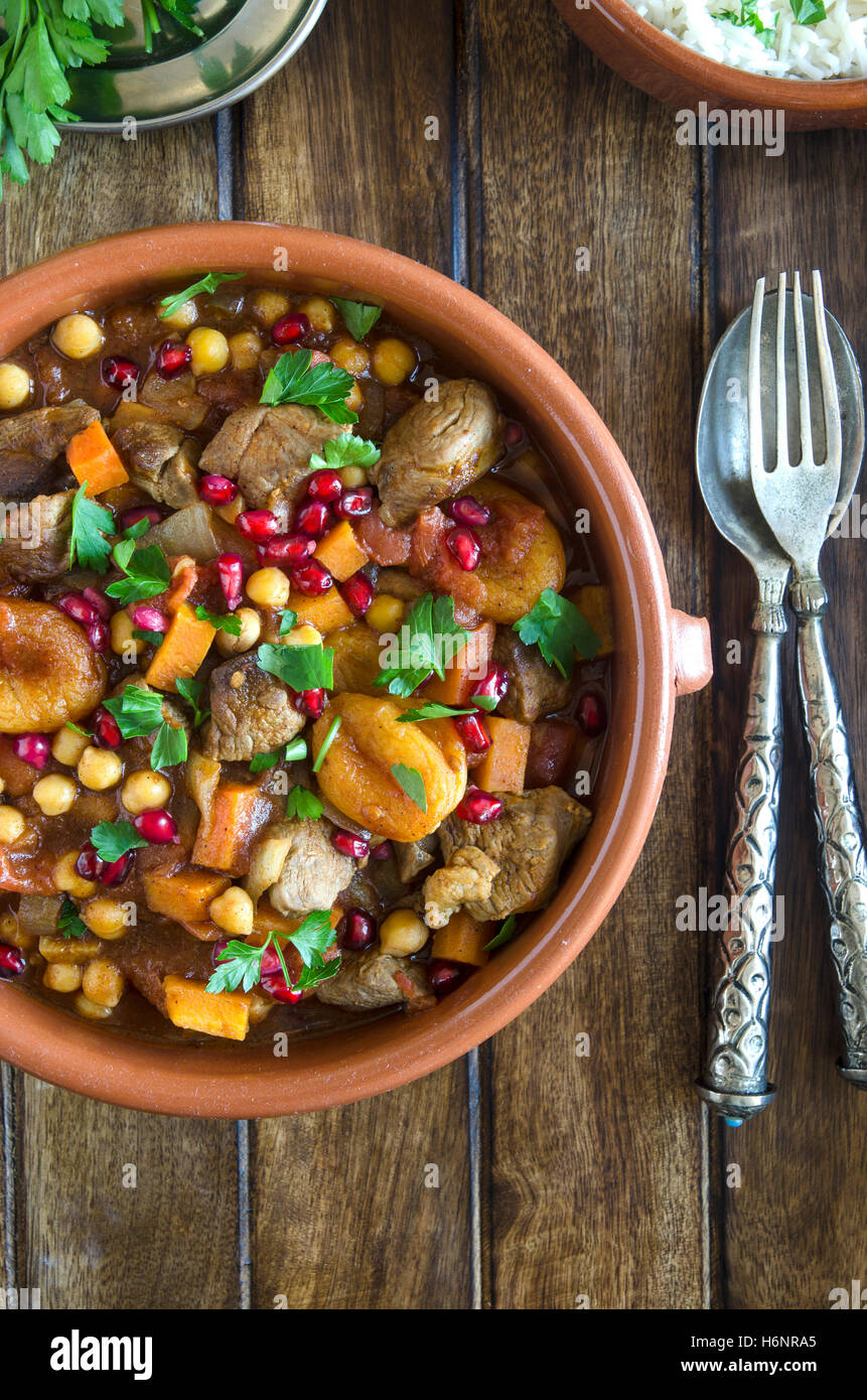 Lamb tagine with chickpeas, apricots and pomegranate seeds Stock Photo